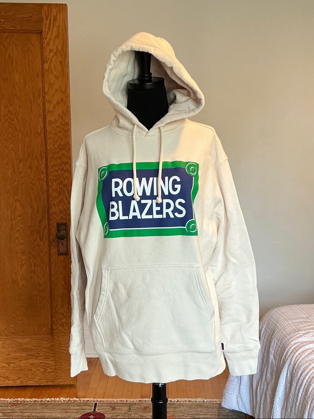Rowing Blazers Cream Hoodie with Green & Blue Chest Graphic